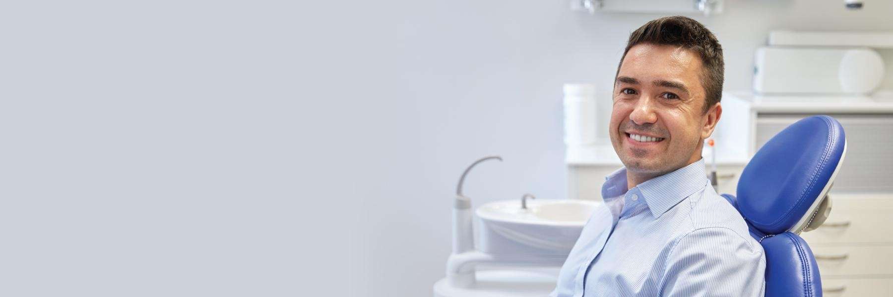 A patient smiling after getting dental emergency dentistry in Neutral Bay
