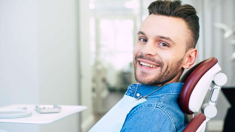 A relaxed male patient getting ready for Stress-Free Visit to the Emergency Dentist